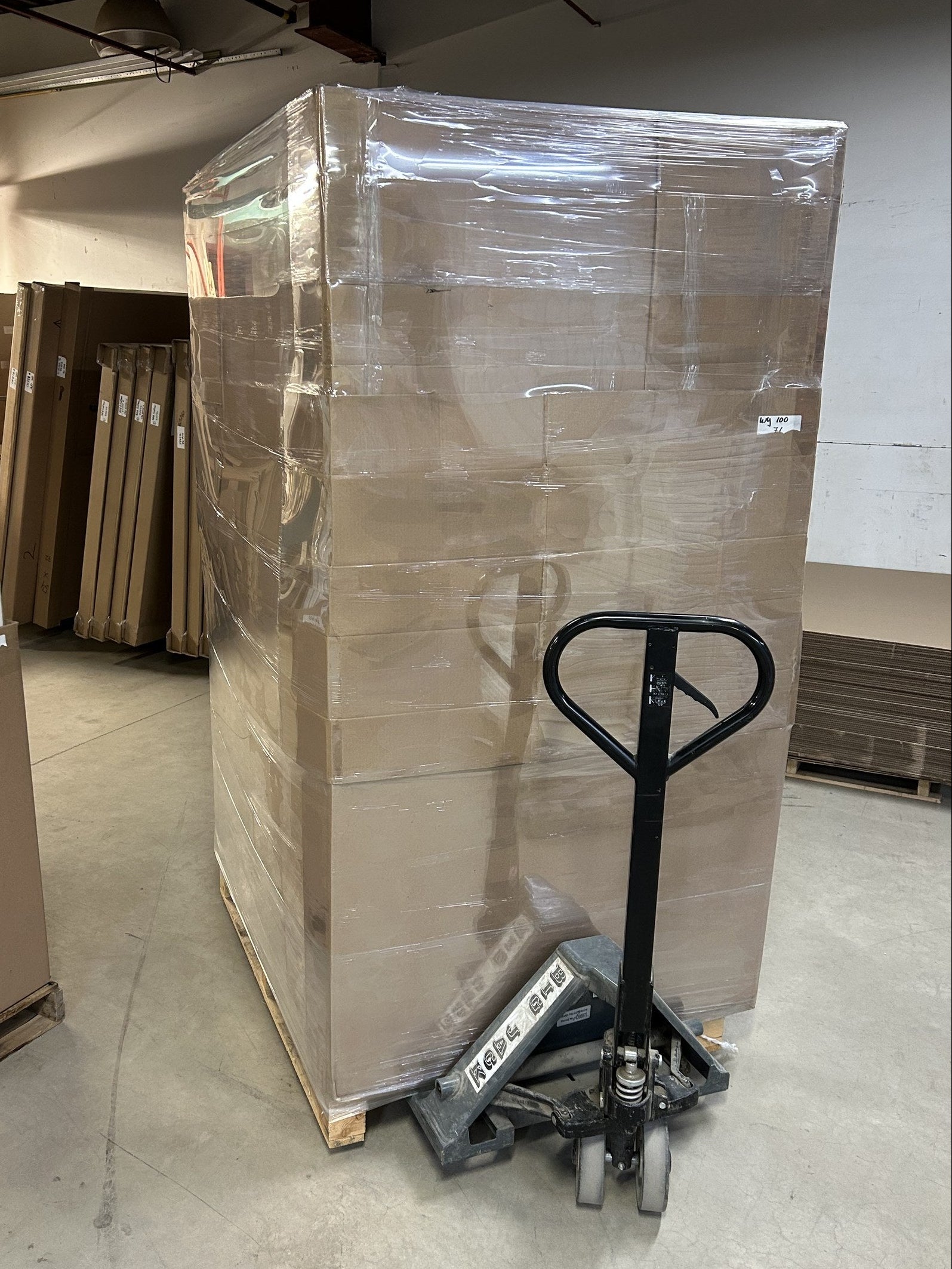 Wrapped pallet of canvas boxes prepared for warehouse transport